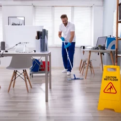 janitor-with-mop-cleaning-office